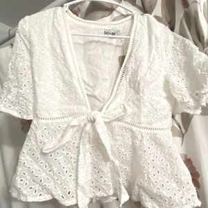 White open shirt with ability to tie.